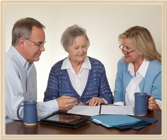 Real Estate Agent Working with Family to Plan Moving